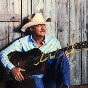 Autographed 8.5x11 photo of Alan Jackson with guitar and cowboy hat