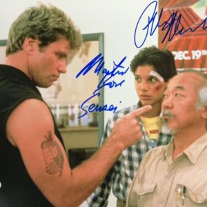 Autographed photo of Martin Kove and William Zabka in Karate Kid dojo confrontation scene