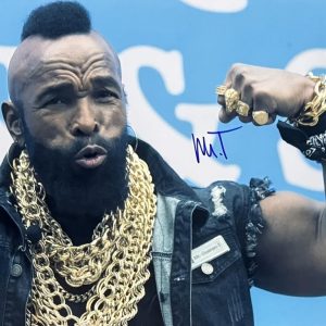 Mr. T flexing with gold chains, signed photo from The A-Team and Rocky III